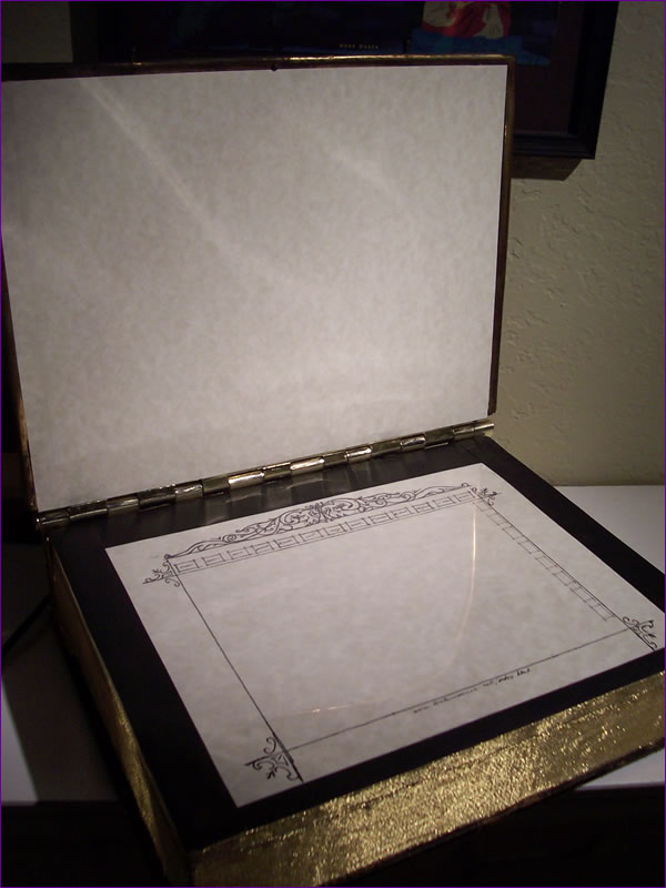 The book opened to show the tablet